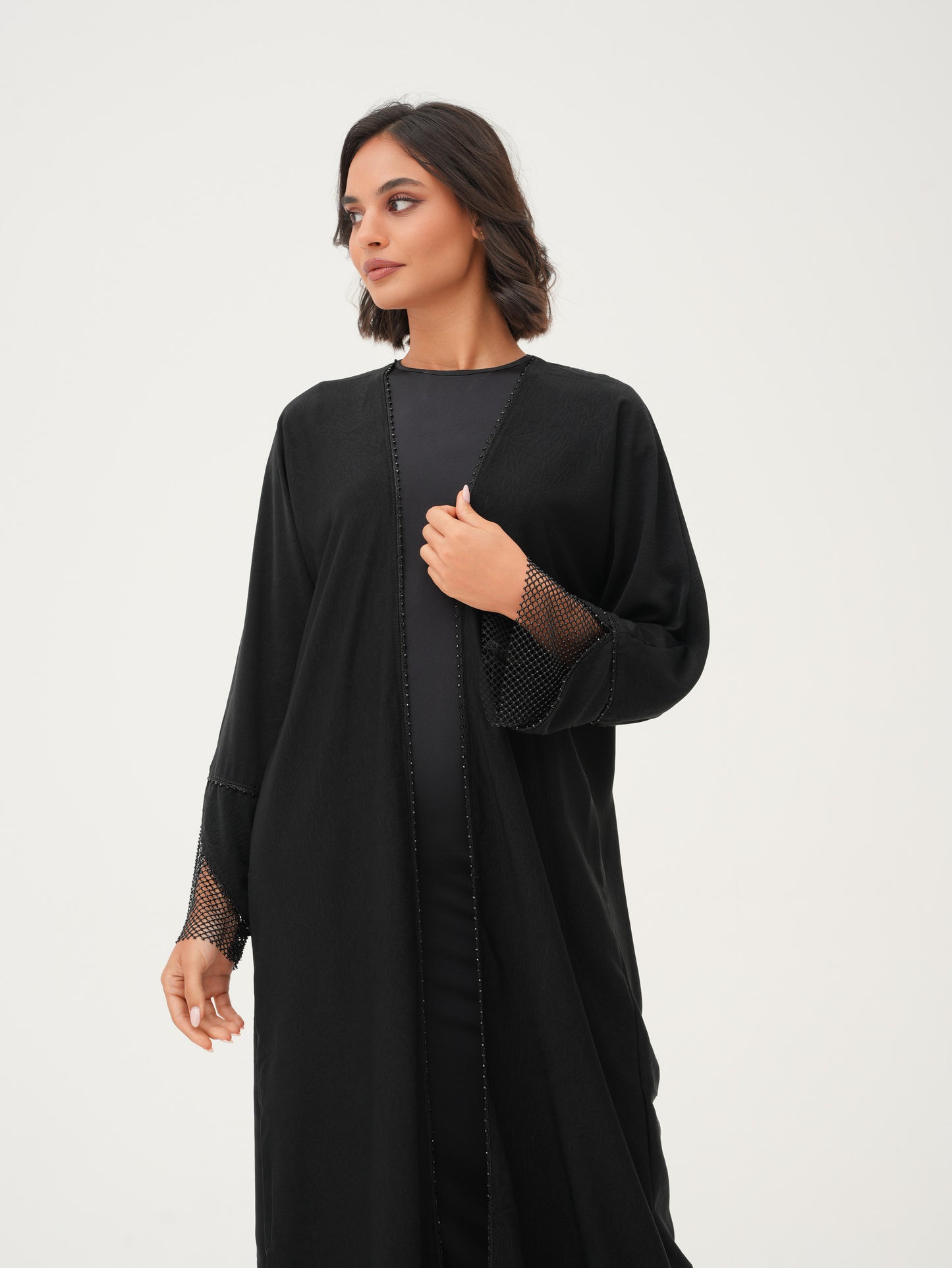 Front-lined beadworks and a unique net cuff on the sleeves abaya