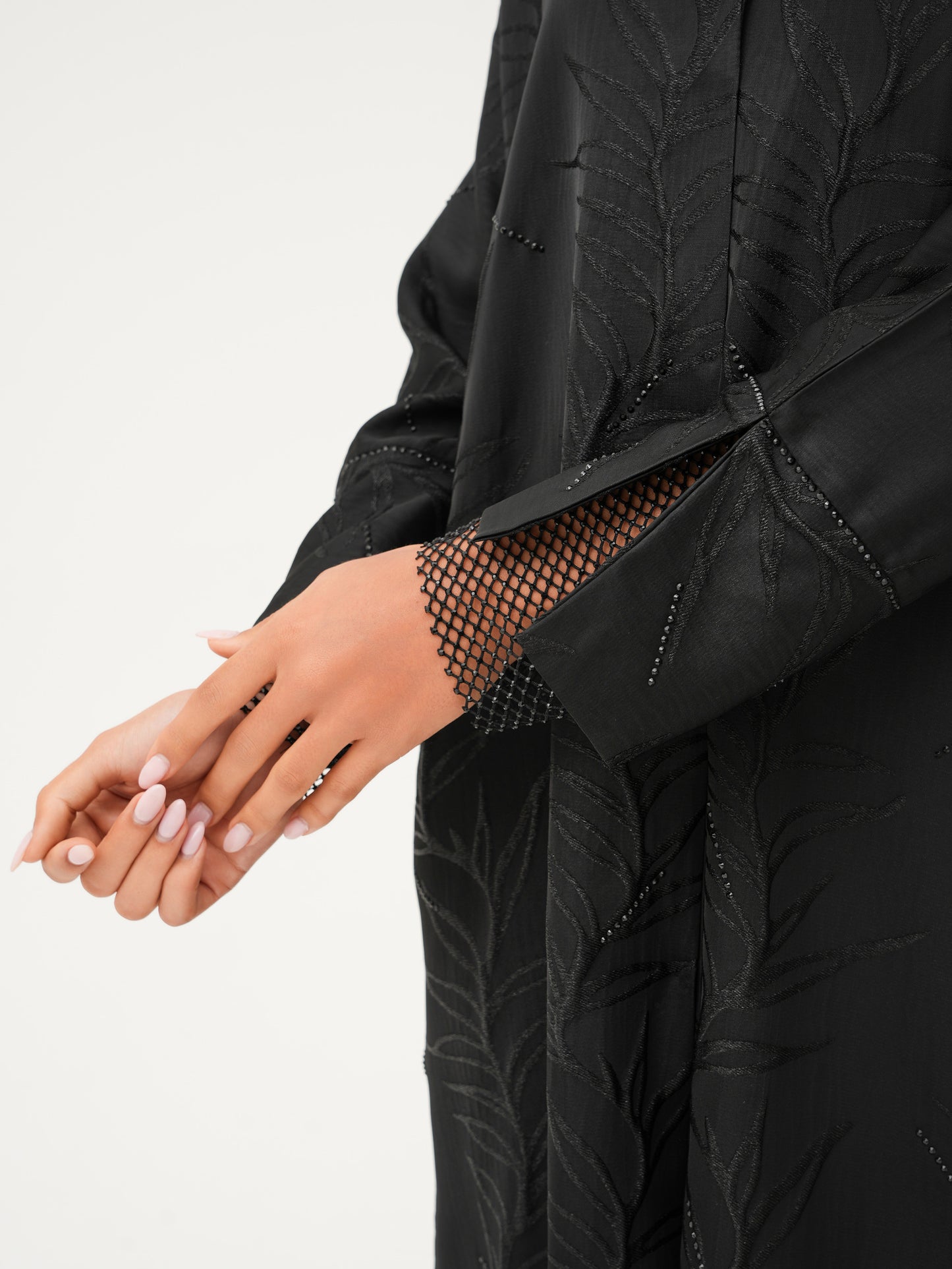 Collared abaya with textured fabric and delicate net detailing on the cuffs