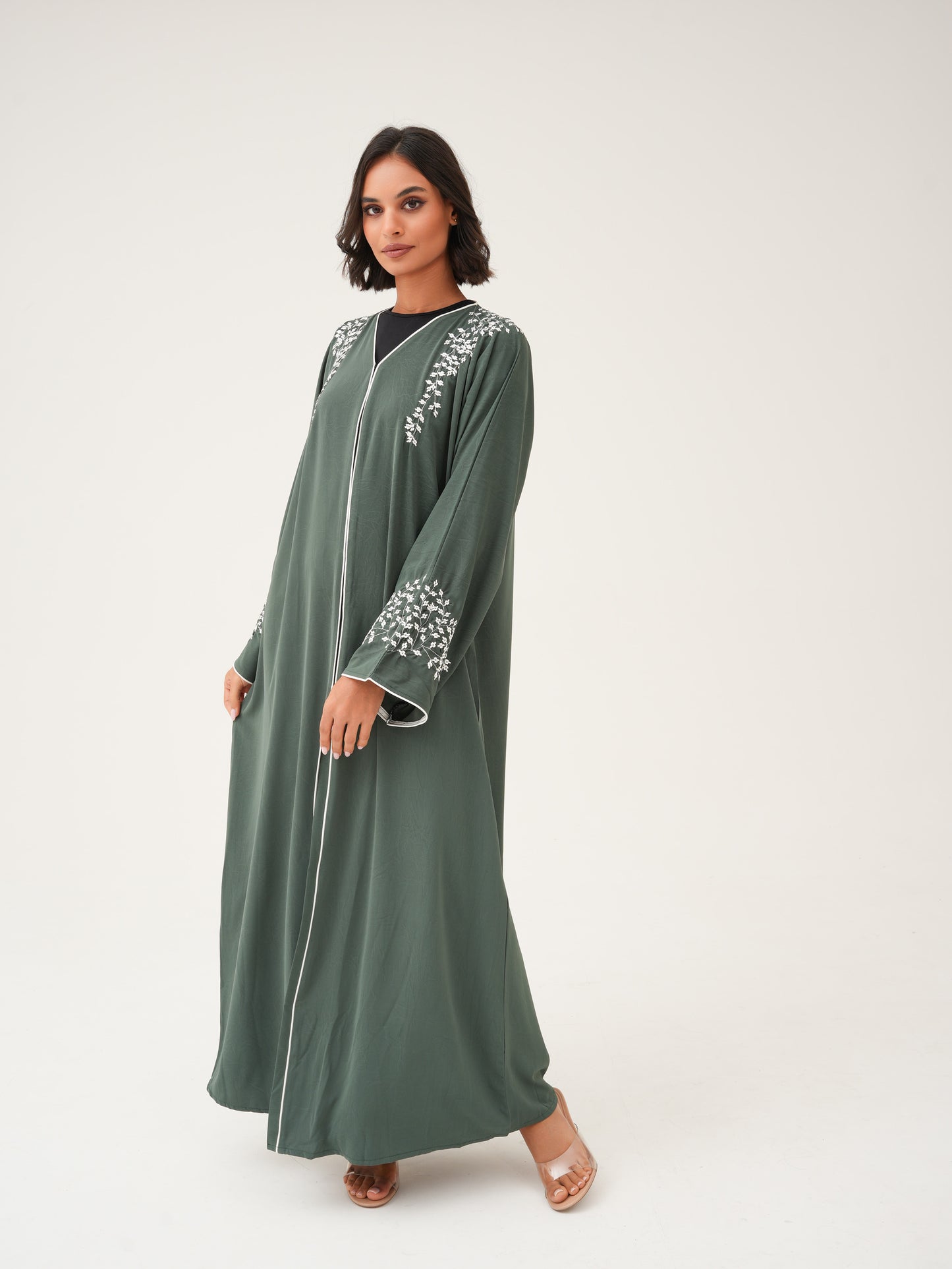 Green abaya with embroidery and piping details