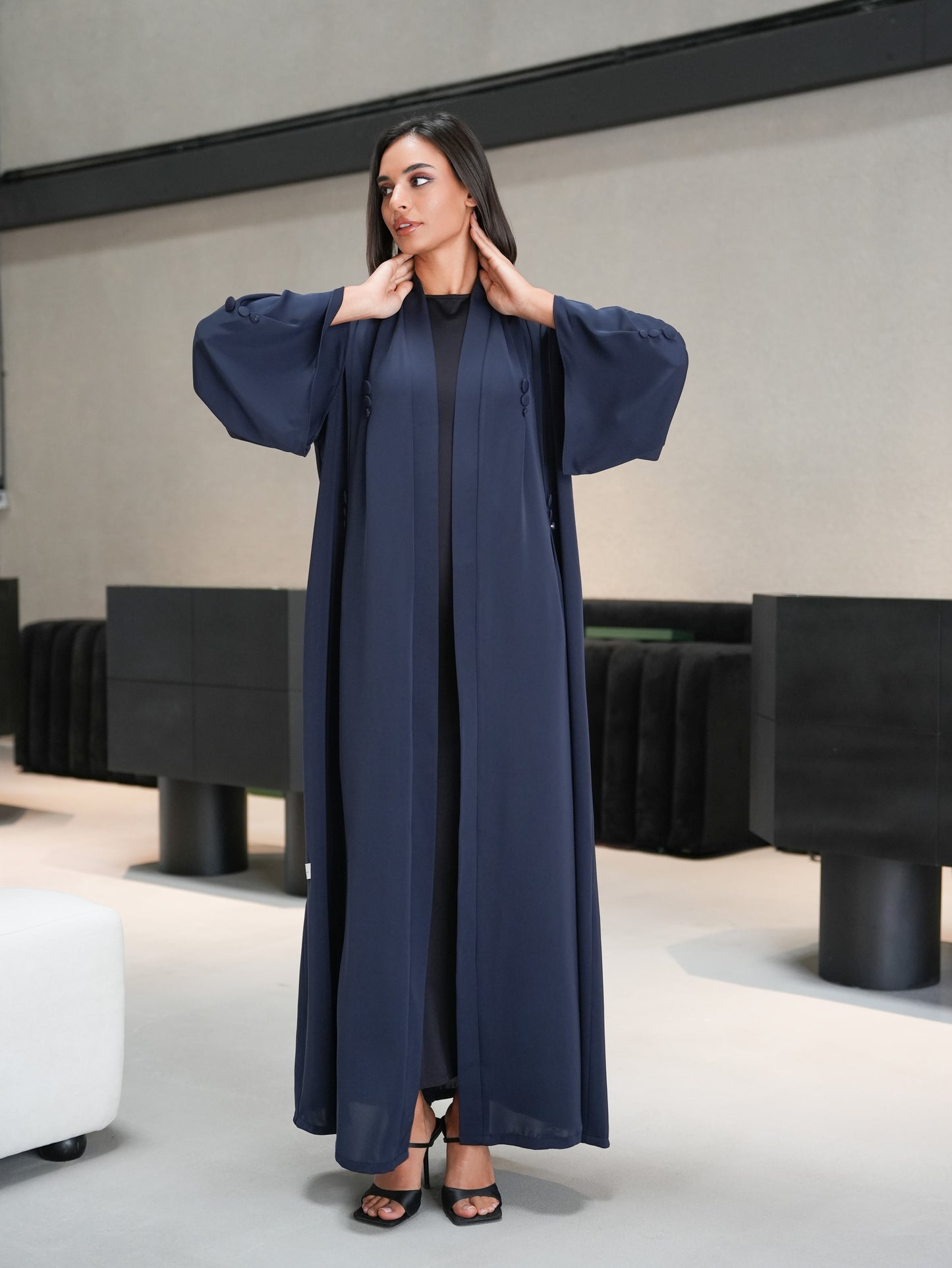 Stunning abaya featuring covered button details cut from nada fabric