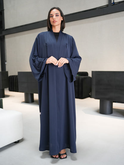 Stunning abaya featuring covered button details cut from nada fabric