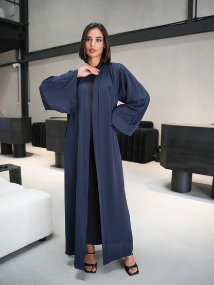 Stunning abaya featuring covered button details cut from nada fabric