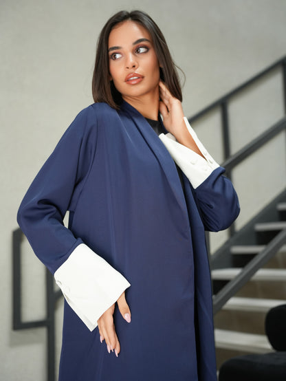 Collared abaya features off-white fabric and button details on the sleeves