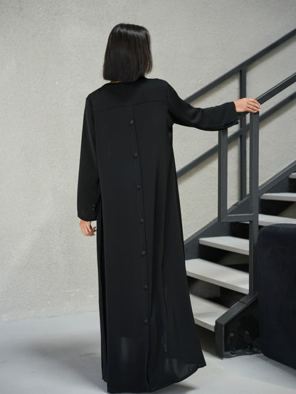 Collared abaya, featuring covered buttoned details