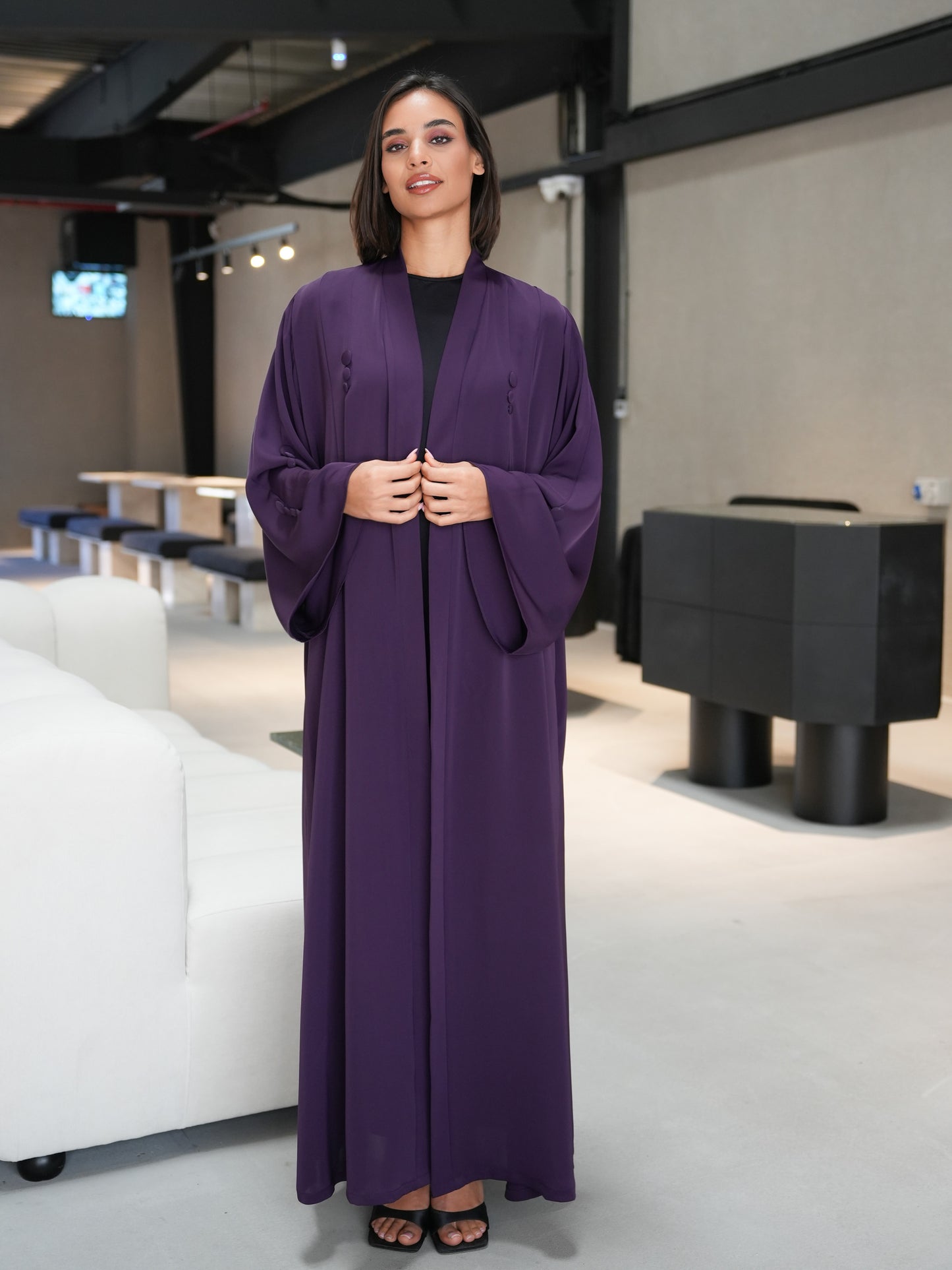 Stunning abaya featuring covered button details cut from nada fabric