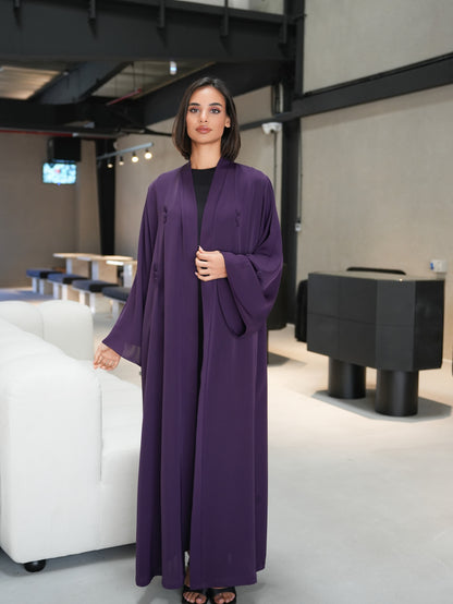 Stunning abaya featuring covered button details cut from nada fabric