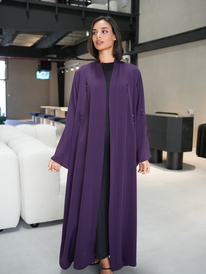 Stunning abaya featuring covered button details cut from nada fabric