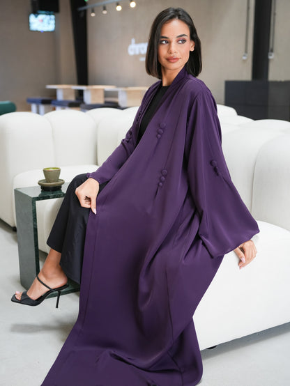 Stunning abaya featuring covered button details cut from nada fabric